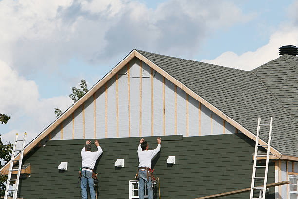 Professional Emergency Siding Repair technician working in Blue Rock, OH